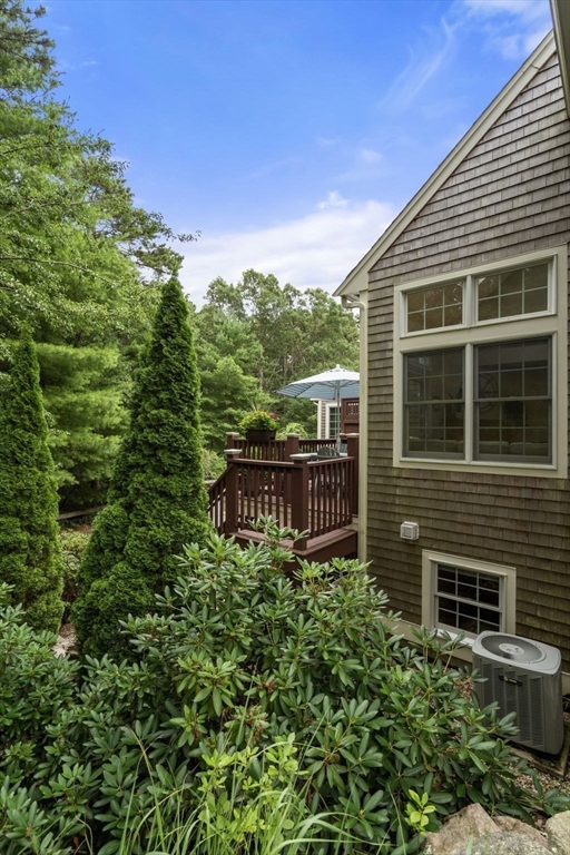 64 Gold Leaf Lane, Unit 64 Mashpee, MA 02649 - Photo 30 of 38 a view of a chairs with wooden fence