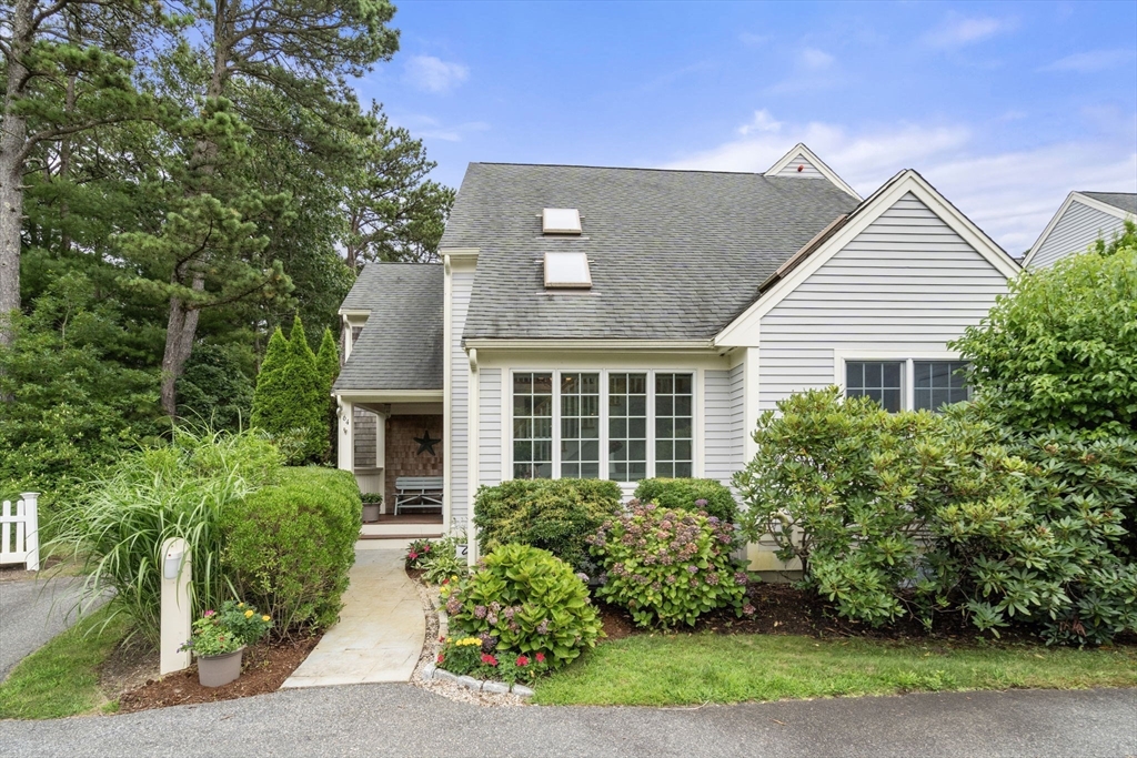 64 Gold Leaf Lane, Unit 64 Mashpee, MA 02649 - Photo 3 of 38 front view of a house with a yard