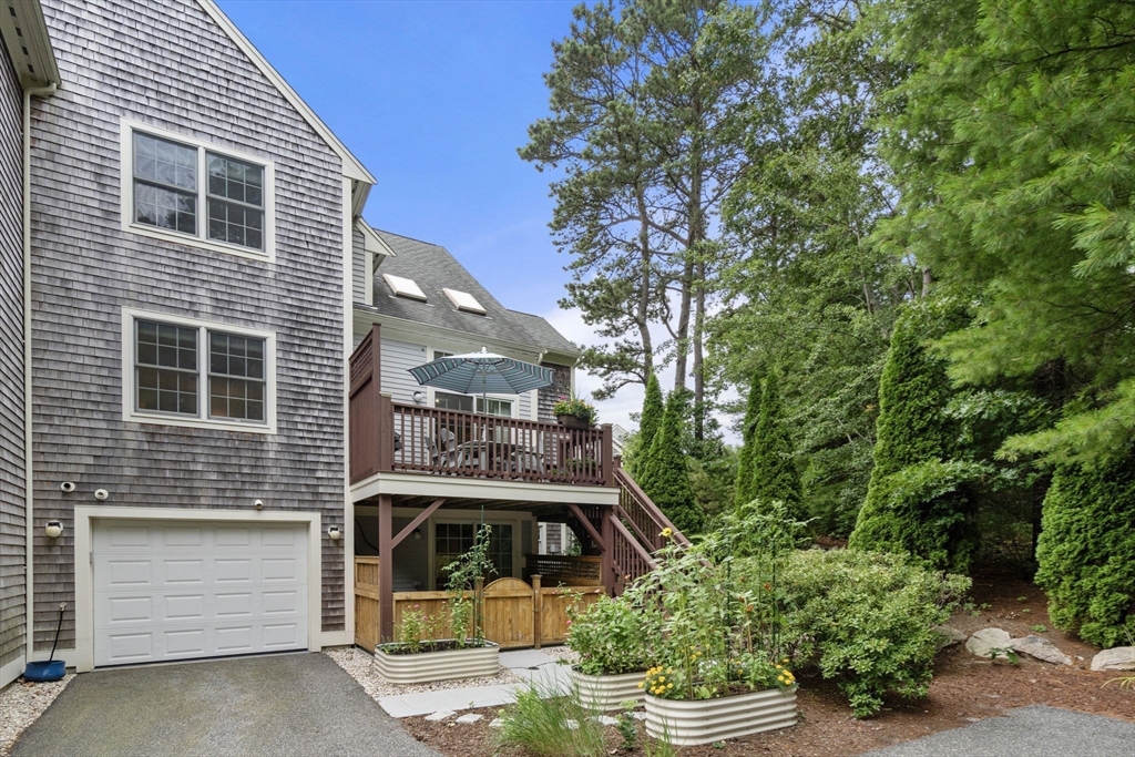 64 Gold Leaf Lane, Unit 64 Mashpee, MA 02649 - Photo 31 of 38 a front view of a house with a yard