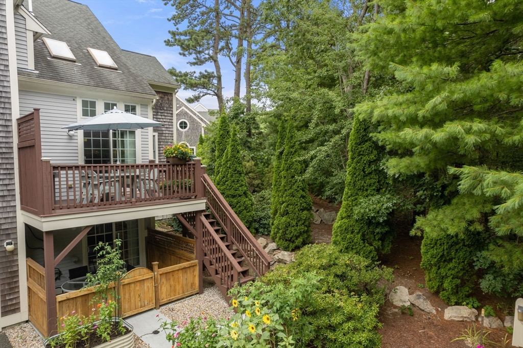 64 Gold Leaf Lane, Unit 64 Mashpee, MA 02649 - Photo 34 of 38 a view of front of house with a yard