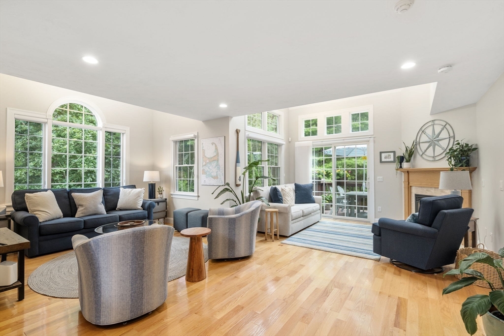 64 Gold Leaf Lane, Unit 64 Mashpee, MA 02649 - Photo 6 of 38 a living room with furniture and a large window