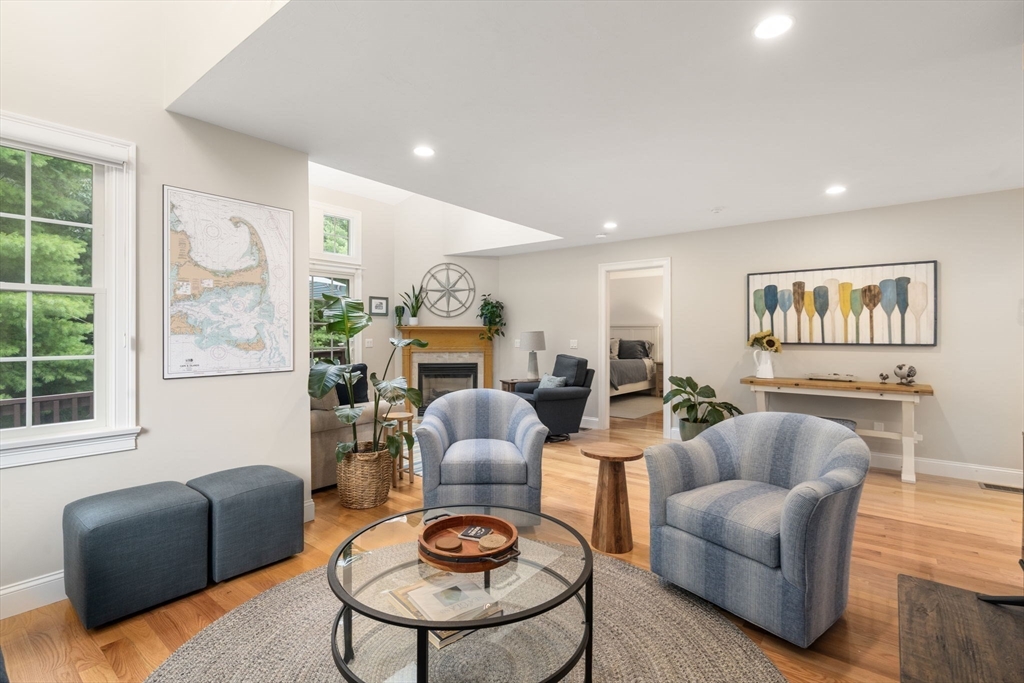 64 Gold Leaf Lane, Unit 64 Mashpee, MA 02649 - Photo 9 of 38 a living room with furniture and a wooden floor