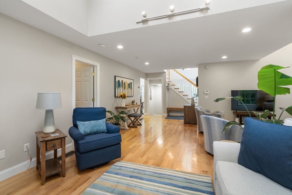 64 Gold Leaf Lane, Unit 64 Mashpee, MA 02649 - Photo 10 of 38 a living room with furniture and a wooden floor