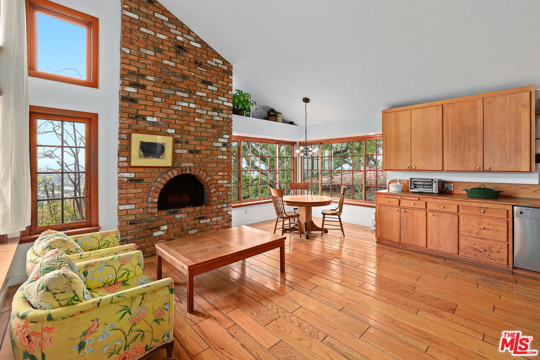 3762 Alta Mesa Drive Studio City, CA 91604 - Photo 12 of 33 a living room with furniture a window and kitchen view