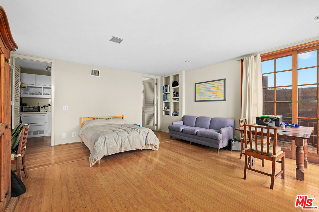 3762 Alta Mesa Drive Studio City, CA 91604 - Photo 21 of 33 a living room with furniture and a large window