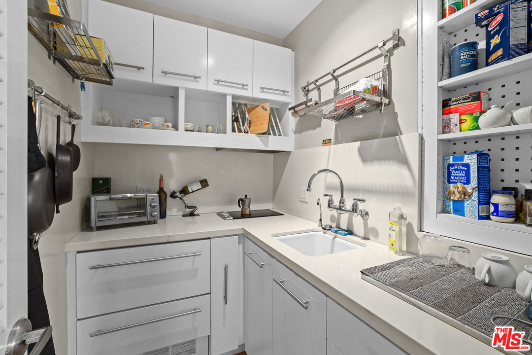 3762 Alta Mesa Drive Studio City, CA 91604 - Photo 22 of 33 a kitchen with stainless steel appliances granite countertop a sink and cabinets