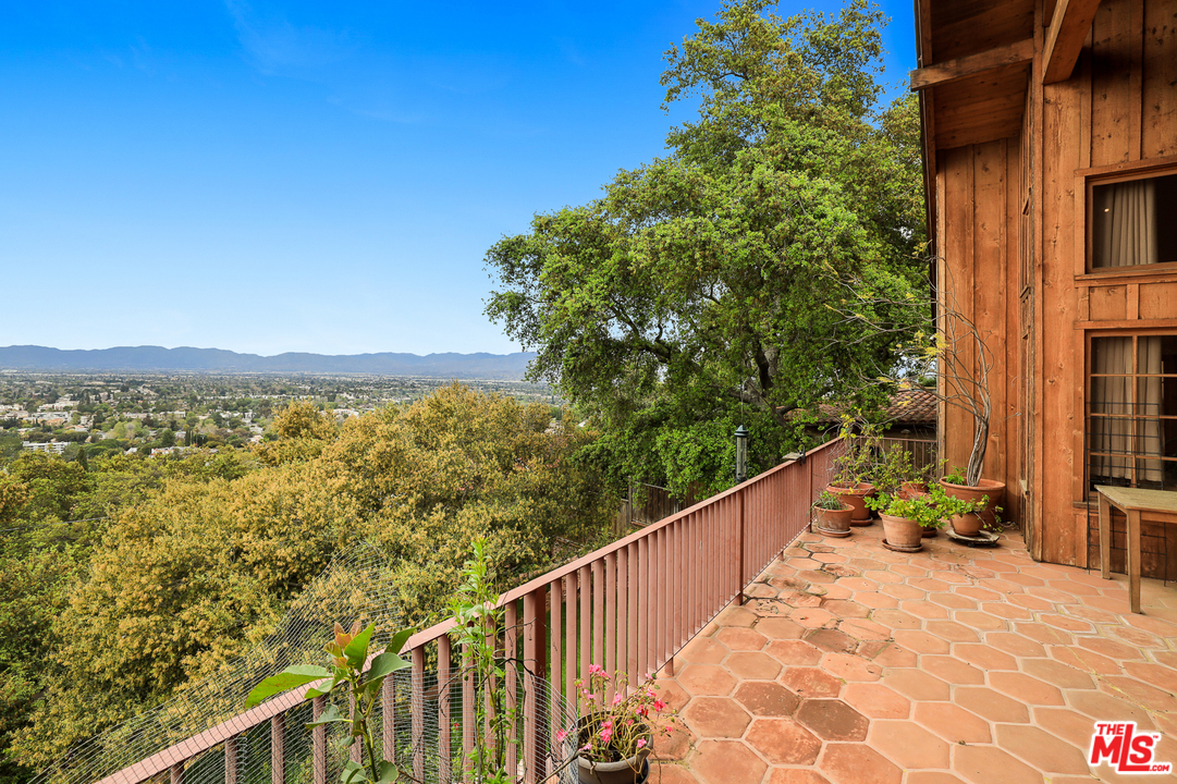3762 Alta Mesa Drive Studio City, CA 91604 - Photo 25 of 33 a view of a balcony with chair and city view