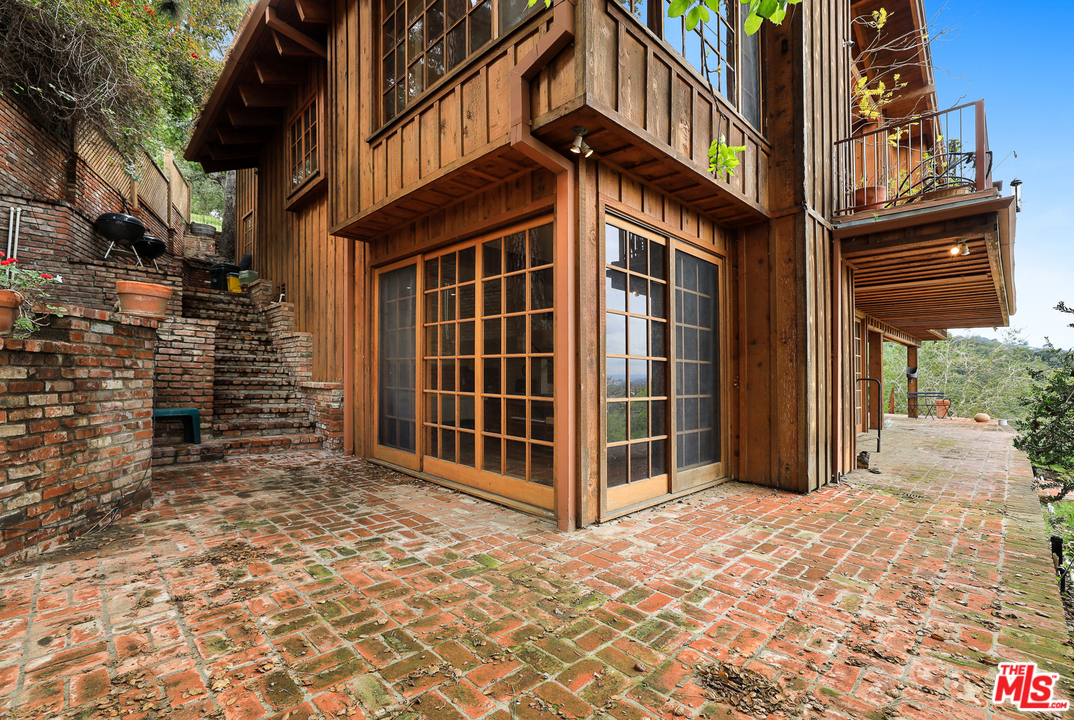 3762 Alta Mesa Drive Studio City, CA 91604 - Photo 28 of 33 a view of a brick house with many windows