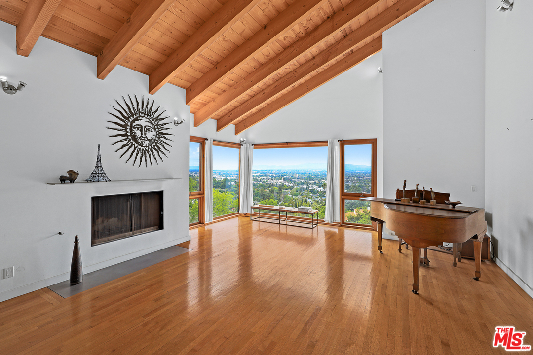 3762 Alta Mesa Drive Studio City, CA 91604 - Photo 9 of 33 a view of a livingroom with furniture and a fireplace