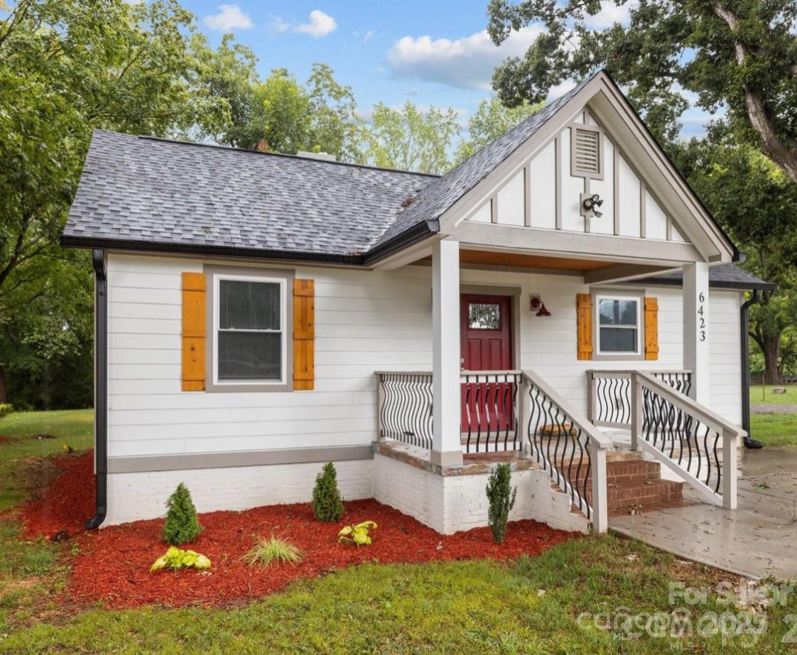 6423 South Tryon Street Charlotte, NC 28217 - Photo 1 of 28 a front view of a house with garden