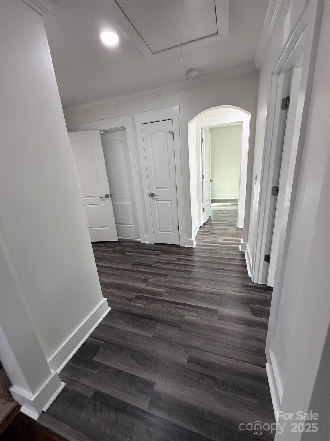 6423 South Tryon Street Charlotte, NC 28217 - Photo 11 of 28 a view of a hallway with wooden floor and staircase