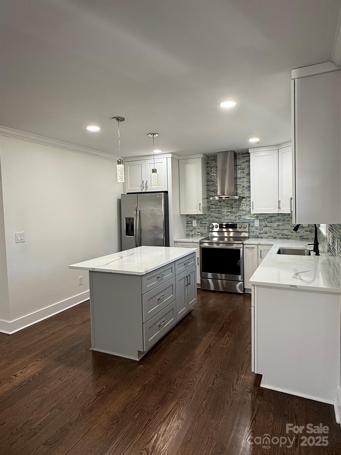 6423 South Tryon Street Charlotte, NC 28217 - Photo 13 of 28 a kitchen with a stove a refrigerator and a sink