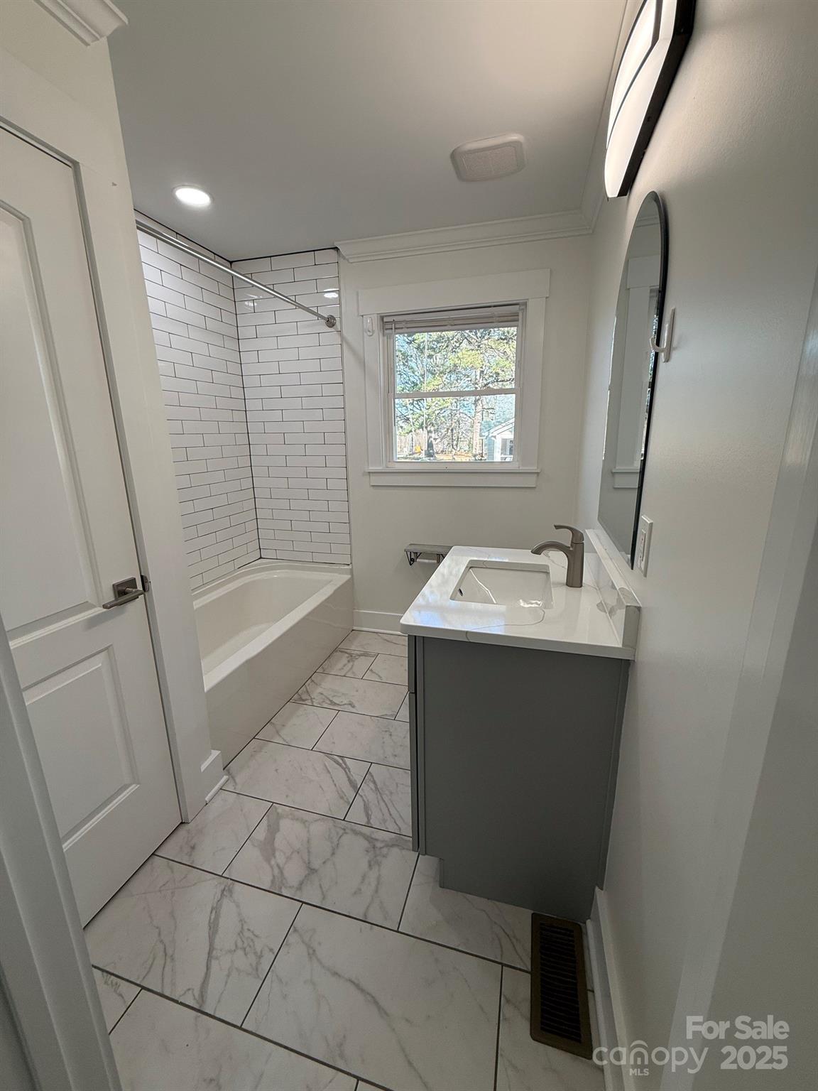6423 South Tryon Street Charlotte, NC 28217 - Photo 17 of 28 a bathroom with a sink toilet and shower