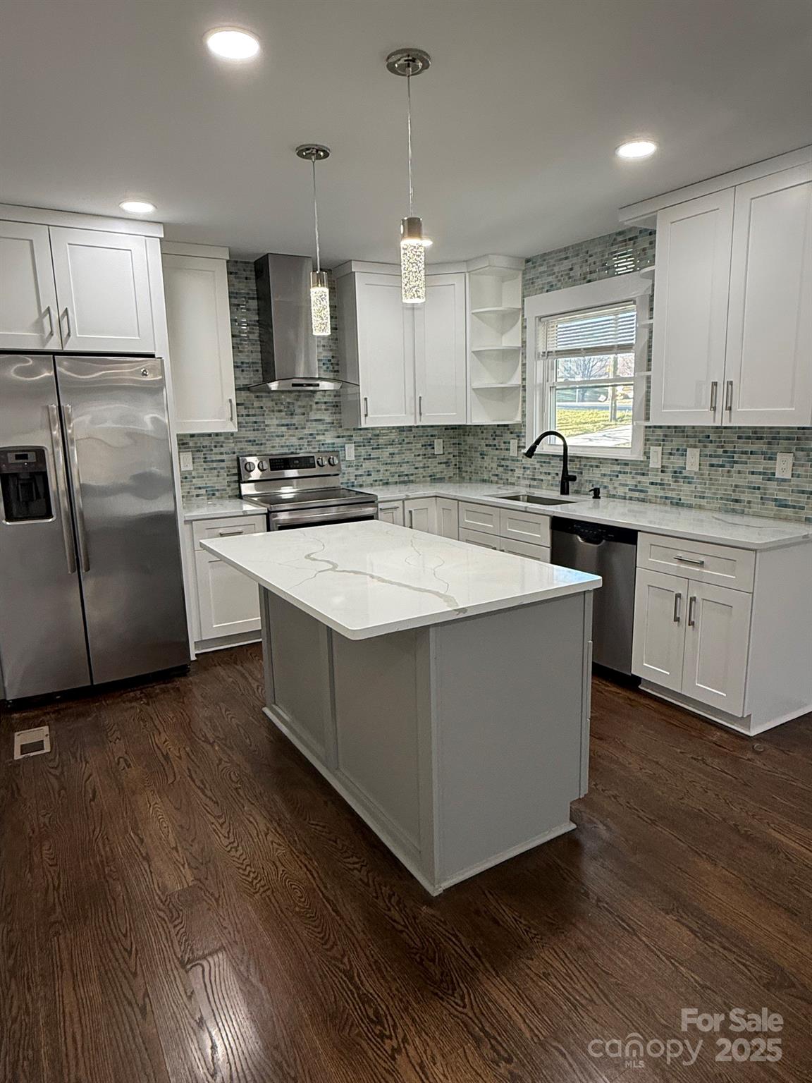 6423 South Tryon Street Charlotte, NC 28217 - Photo 18 of 28 a kitchen with stainless steel appliances granite countertop a sink a stove a refrigerator and island with wooden floor