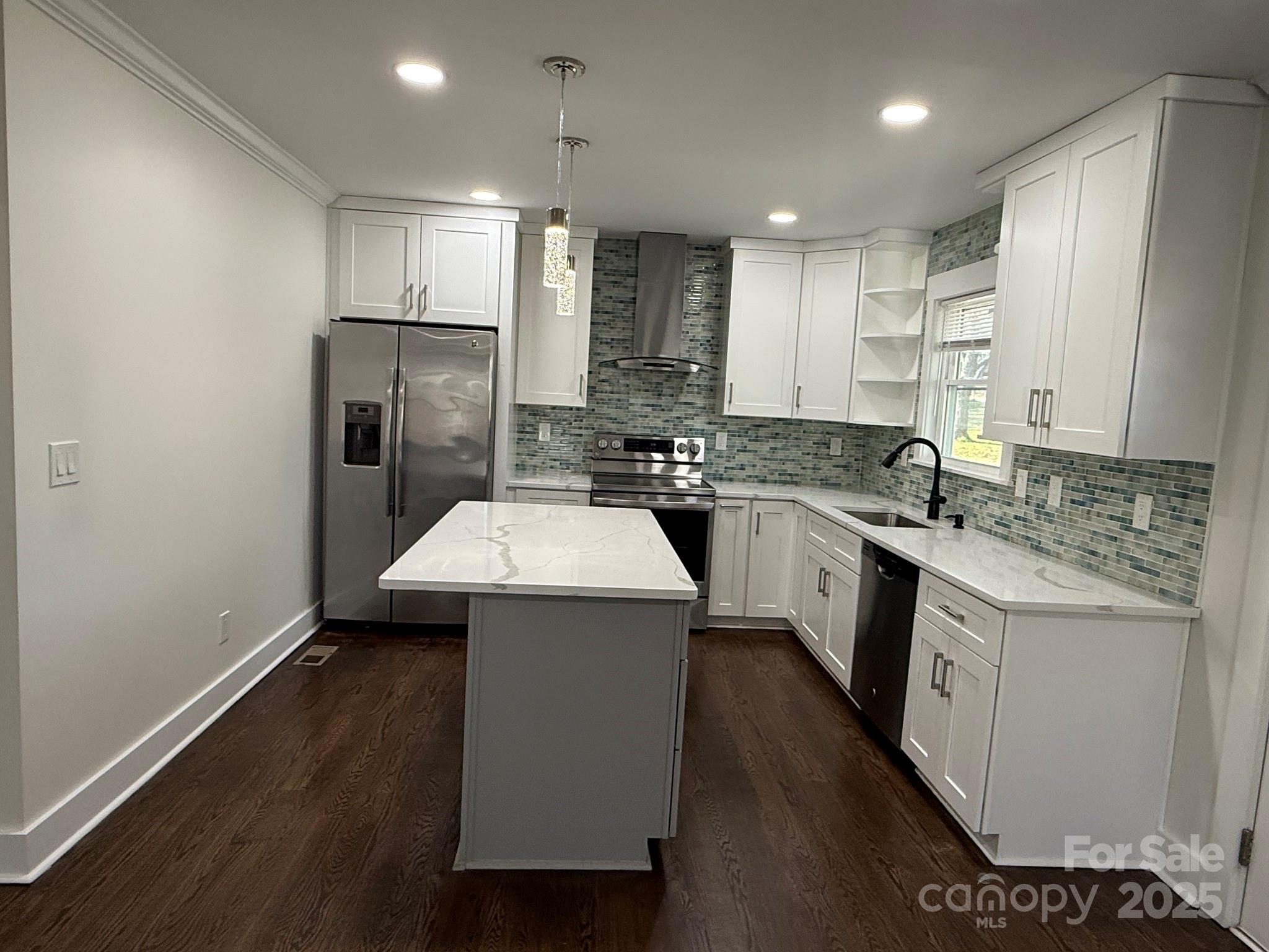 6423 South Tryon Street Charlotte, NC 28217 - Photo 20 of 28 a kitchen with a sink stove and refrigerator