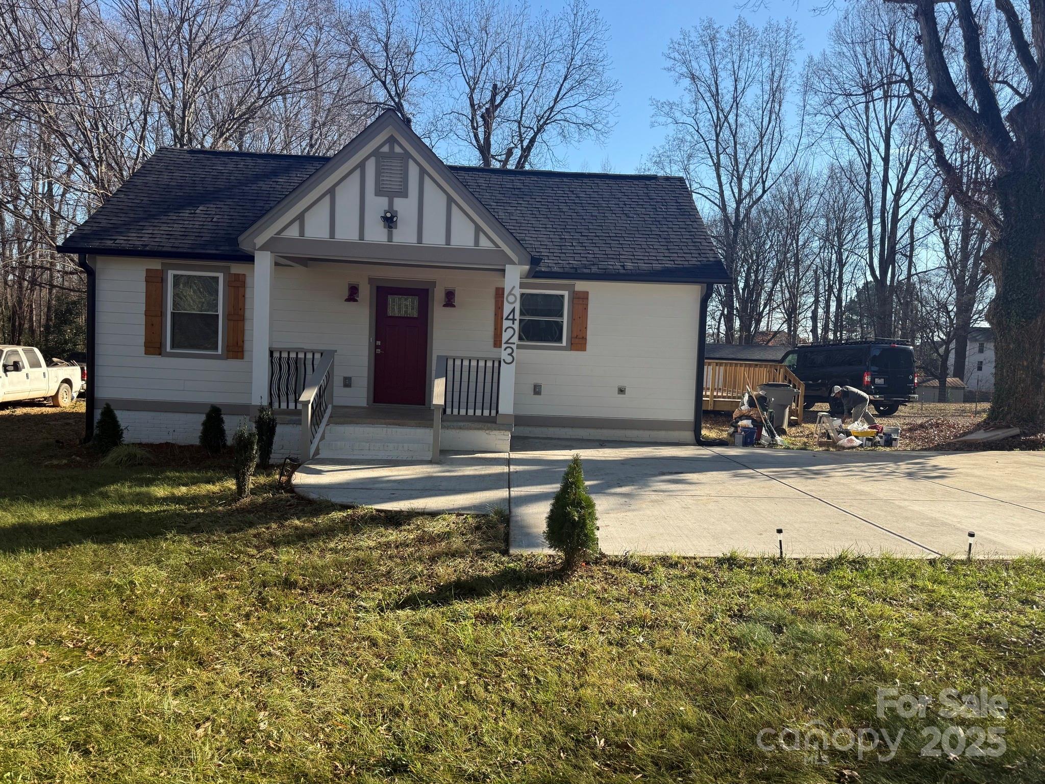 6423 South Tryon Street Charlotte, NC 28217 - Photo 25 of 28 a front view of a house with a yard