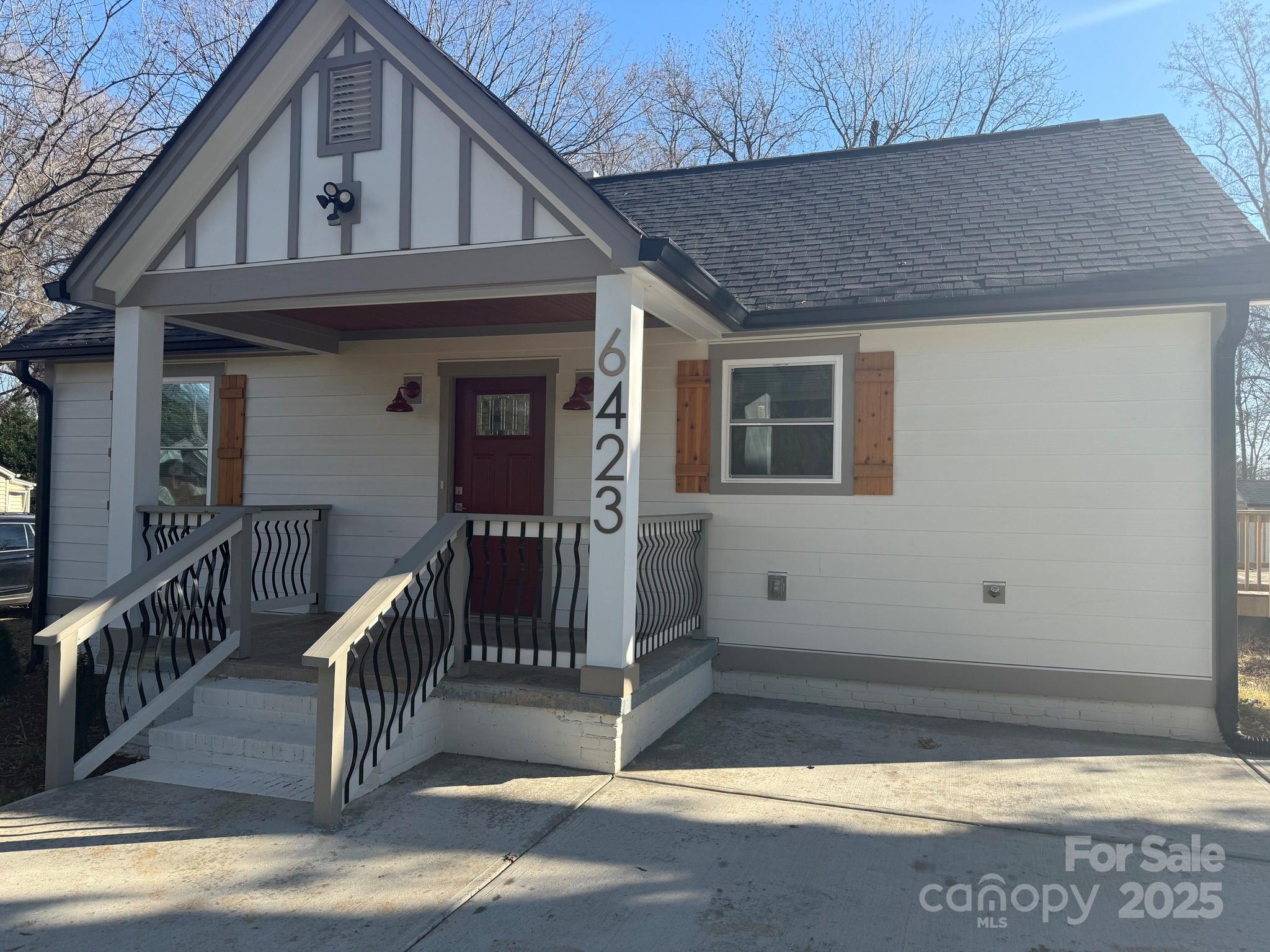 6423 South Tryon Street Charlotte, NC 28217 - Photo 4 of 28 a view of a house with wooden fence
