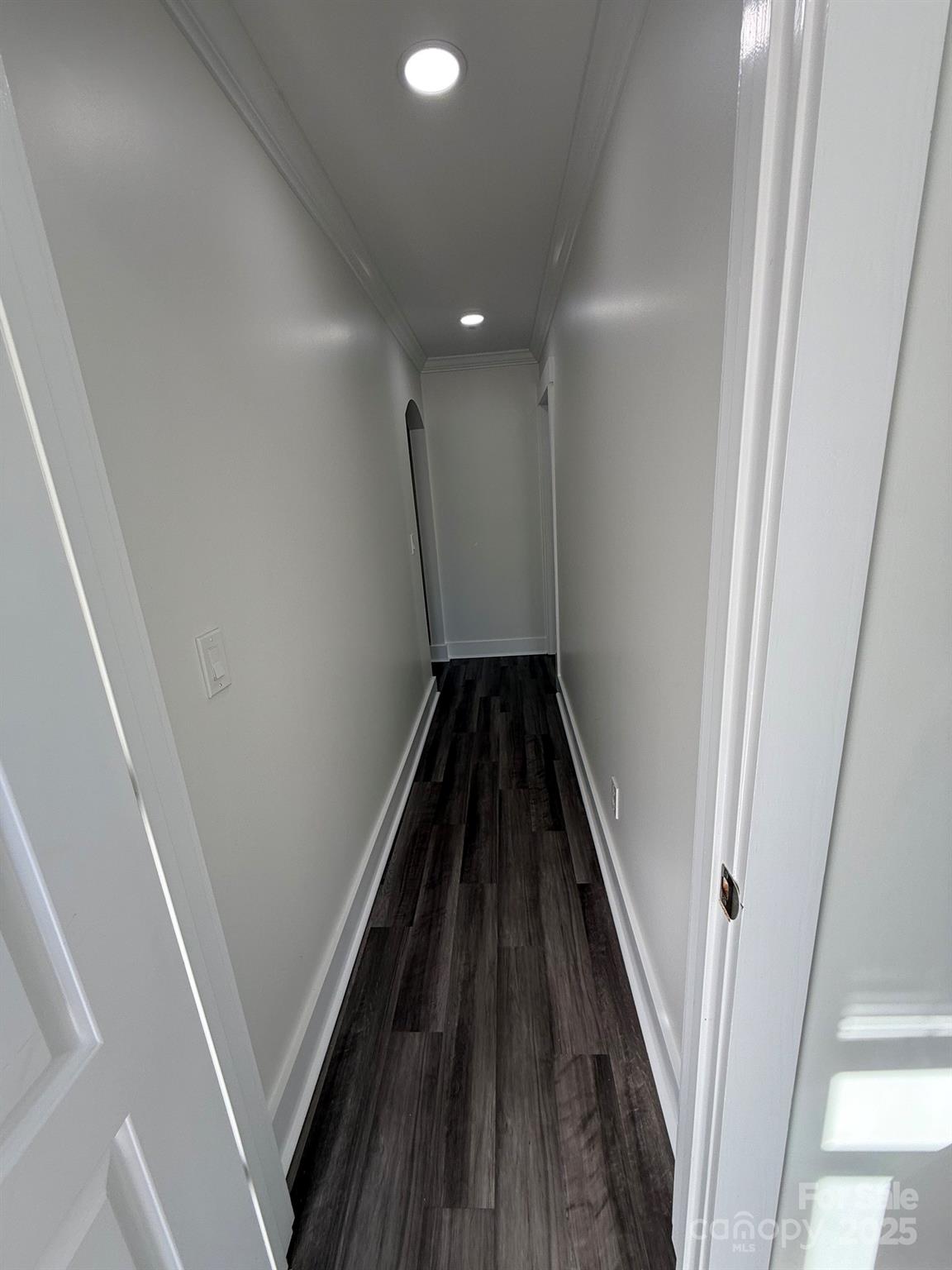 6423 South Tryon Street Charlotte, NC 28217 - Photo 9 of 28 a view of a hallway with wooden floor and staircase