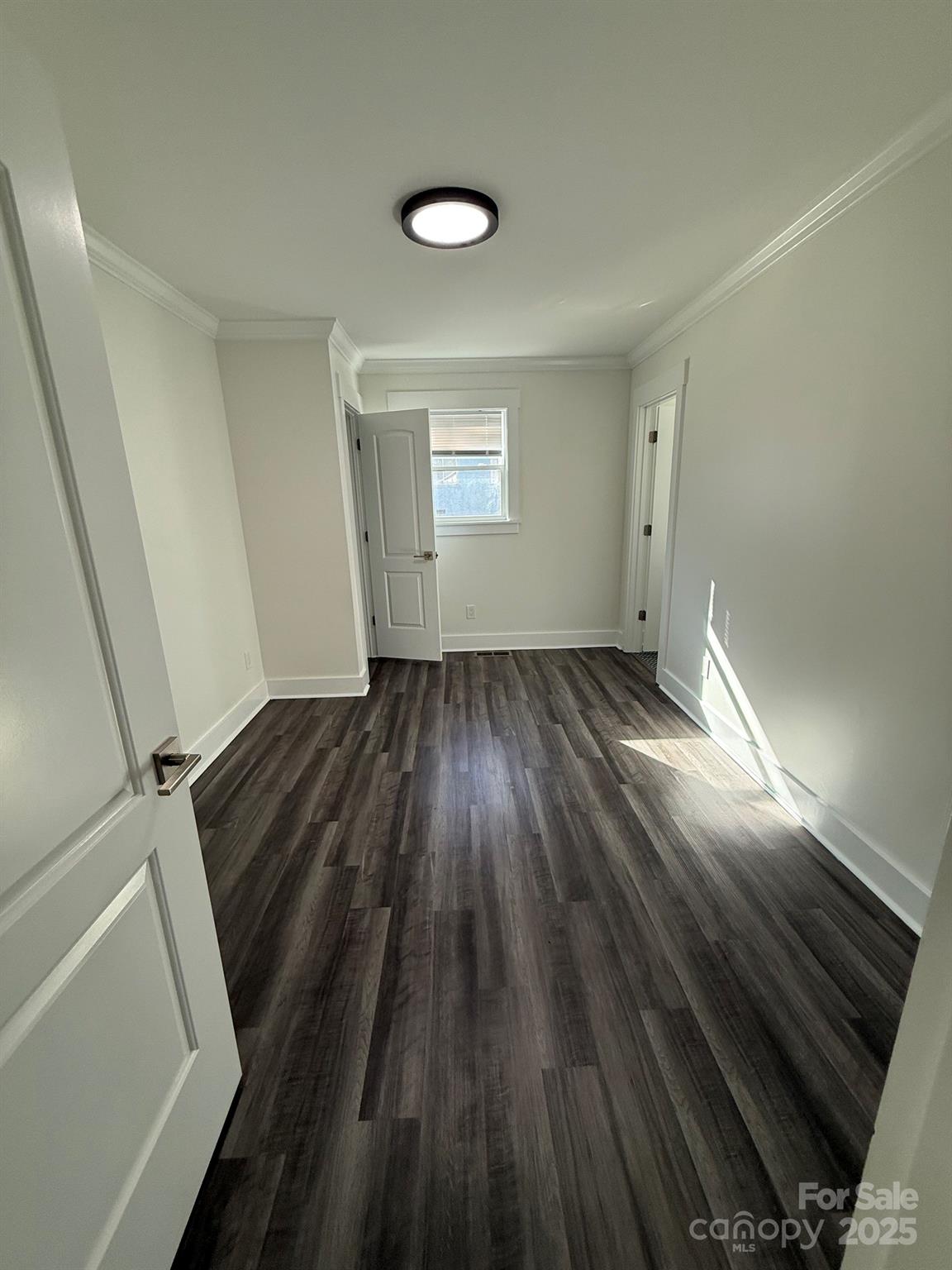 6423 South Tryon Street Charlotte, NC 28217 - Photo 10 of 28 wooden floor in an empty room