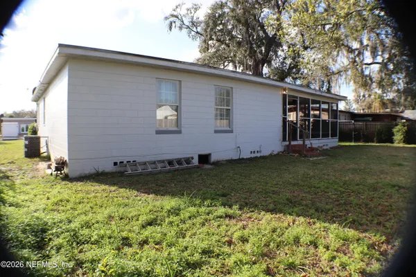 a backyard of a house with lots of green space