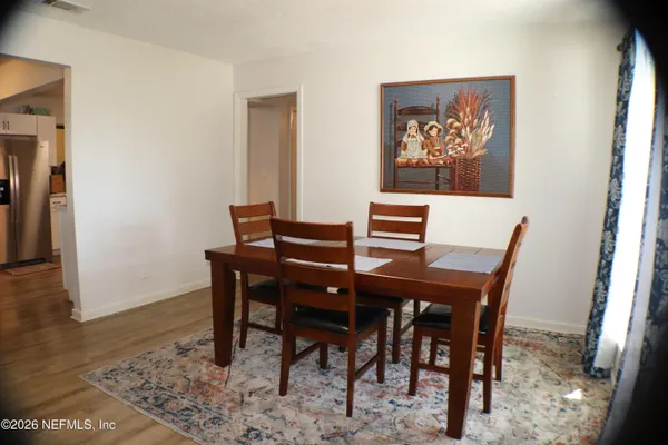 a view of a dining room with furniture