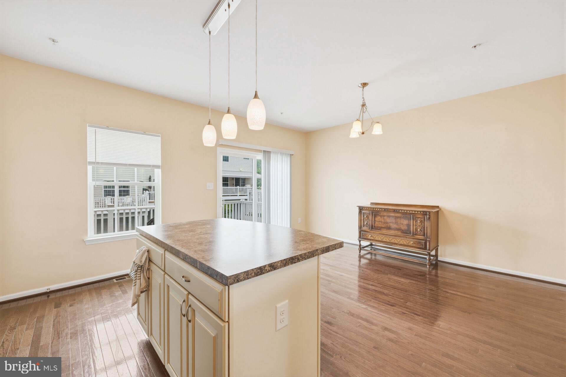 325 Schmidt Road Phoenixville, PA 19460 - Photo 15 of 27 a kitchen with a table chairs and wooden floor