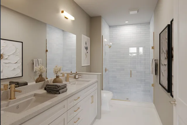 a bathroom with a double vanity sink toilet double and shower