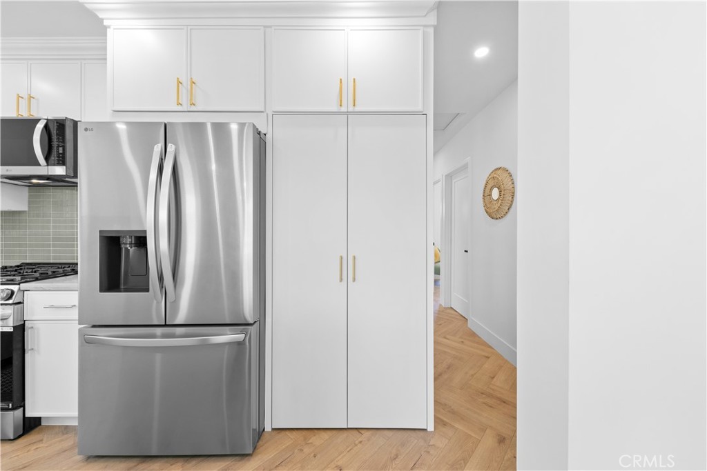 3937 2nd Avenue Los Angeles, CA 90008 - Photo 17 of 47 a view of a kitchen with a refrigerator