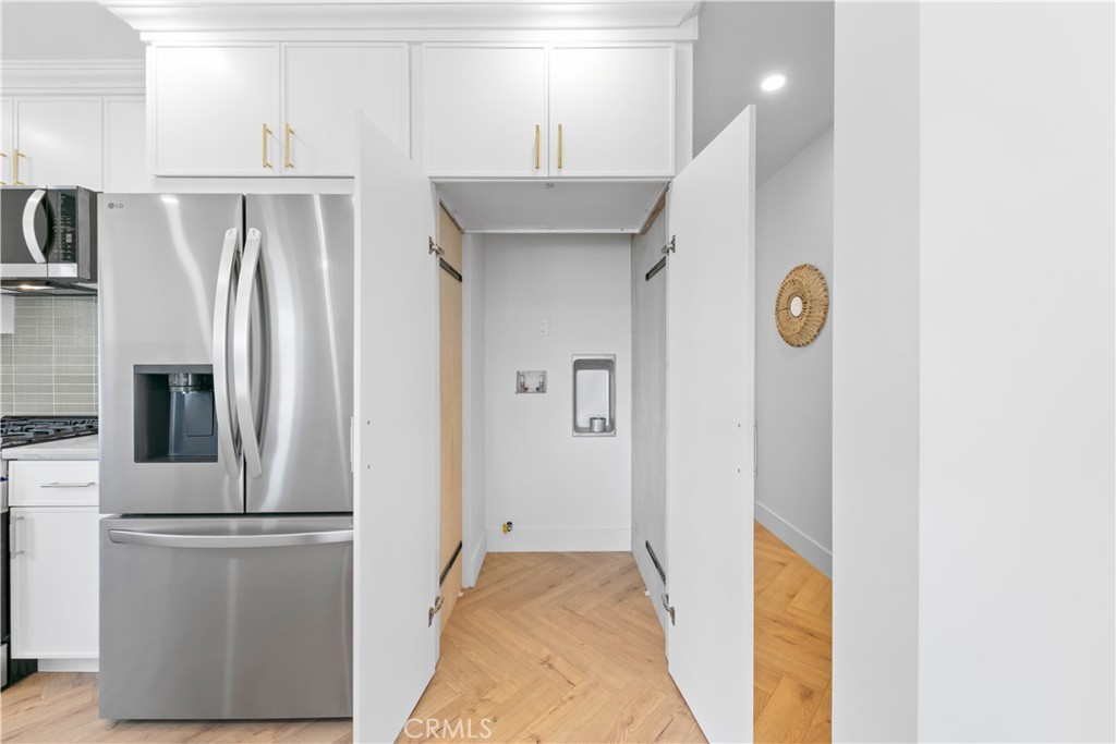 3937 2nd Avenue Los Angeles, CA 90008 - Photo 18 of 47 a kitchen with a refrigerator and a sink