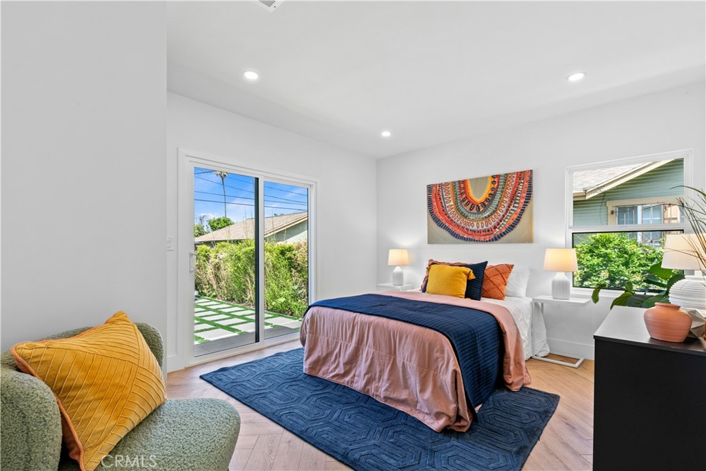 3937 2nd Avenue Los Angeles, CA 90008 - Photo 20 of 47 a bed sitting in a bedroom next to a window