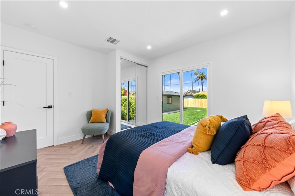 3937 2nd Avenue Los Angeles, CA 90008 - Photo 21 of 47 a bedroom with a bed couch and window