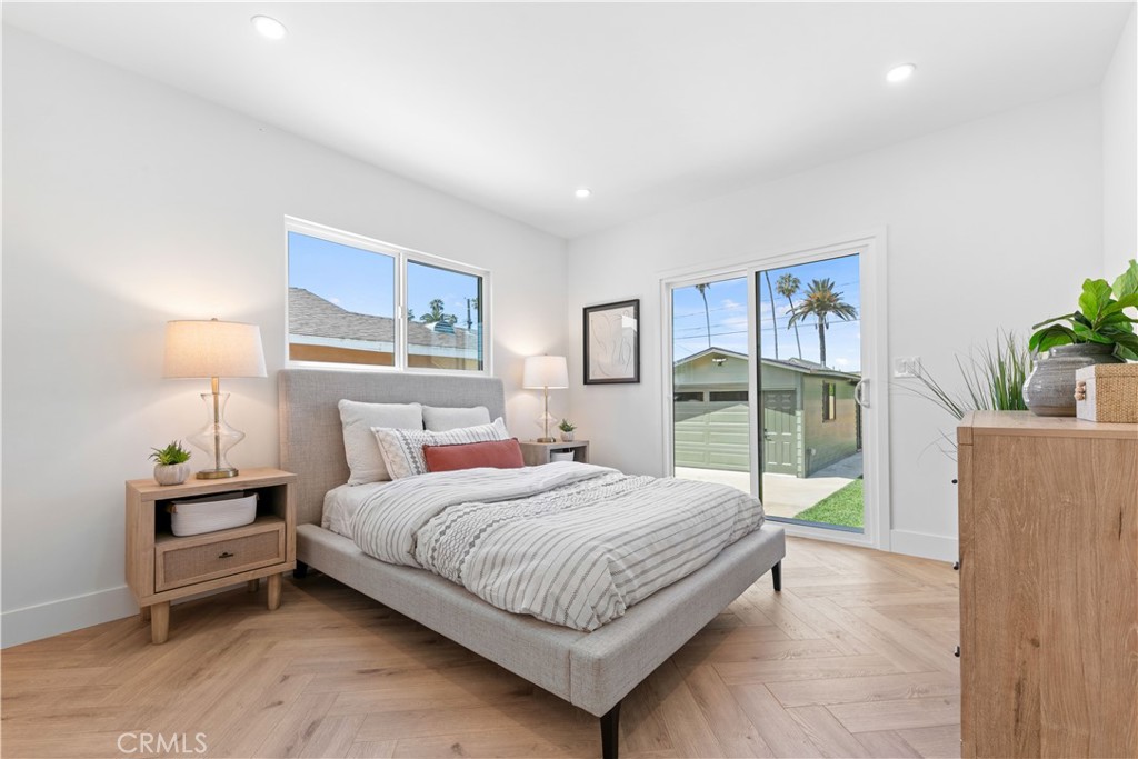 3937 2nd Avenue Los Angeles, CA 90008 - Photo 22 of 47 a bedroom with a large bed and a large window