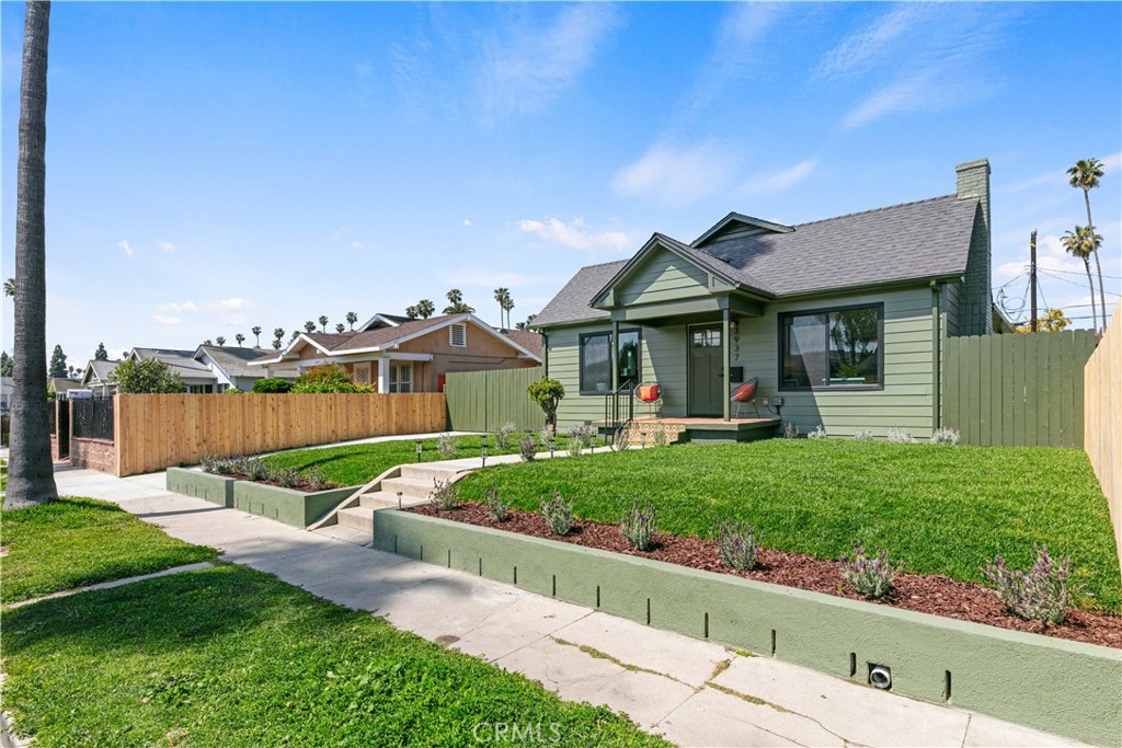 3937 2nd Avenue Los Angeles, CA 90008 - Photo 3 of 47 a view of a house with garden and a pond