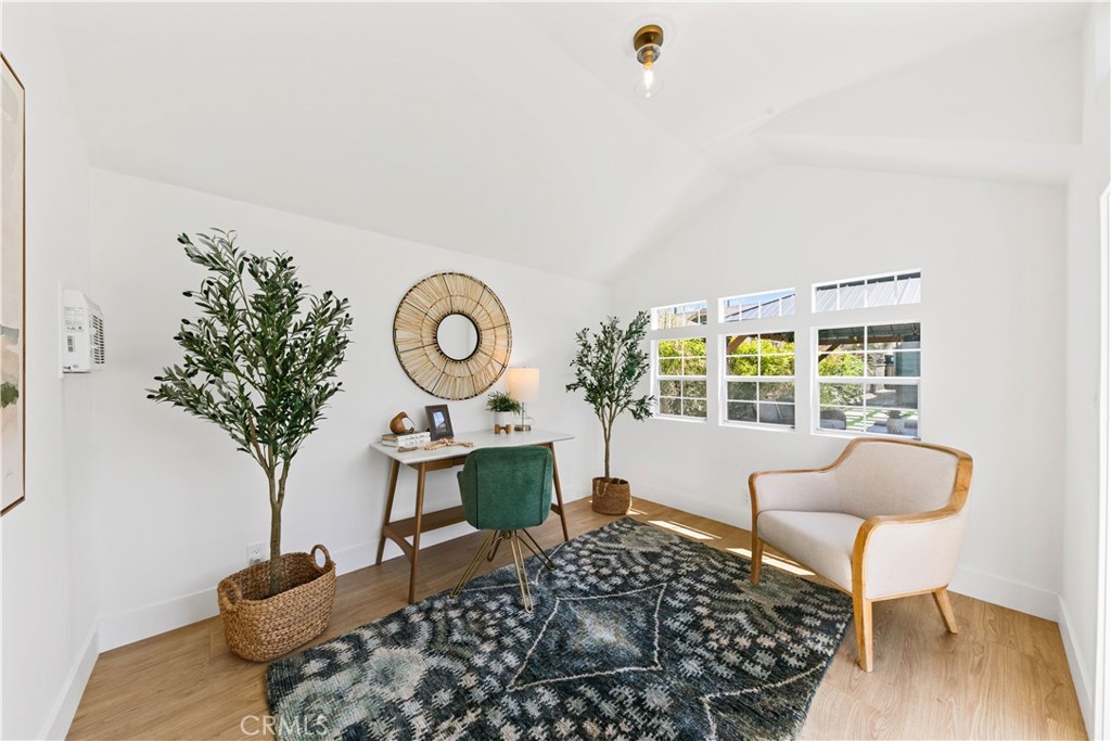 3937 2nd Avenue Los Angeles, CA 90008 - Photo 39 of 47 a living room with furniture and a potted plant
