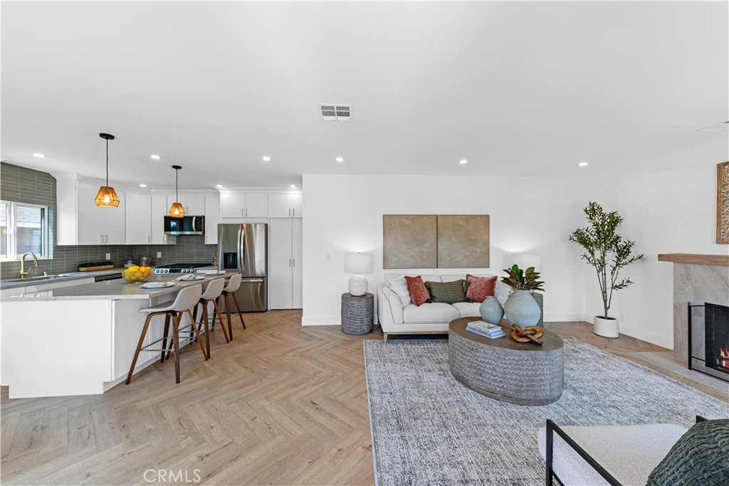 3937 2nd Avenue Los Angeles, CA 90008 - Photo 6 of 47 a living room with furniture kitchen view and a potted plant