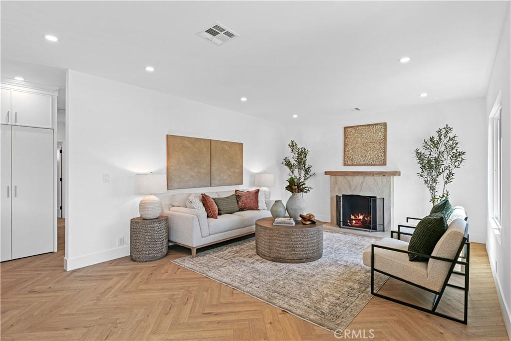 3937 2nd Avenue Los Angeles, CA 90008 - Photo 7 of 47 a living room with furniture and a fireplace