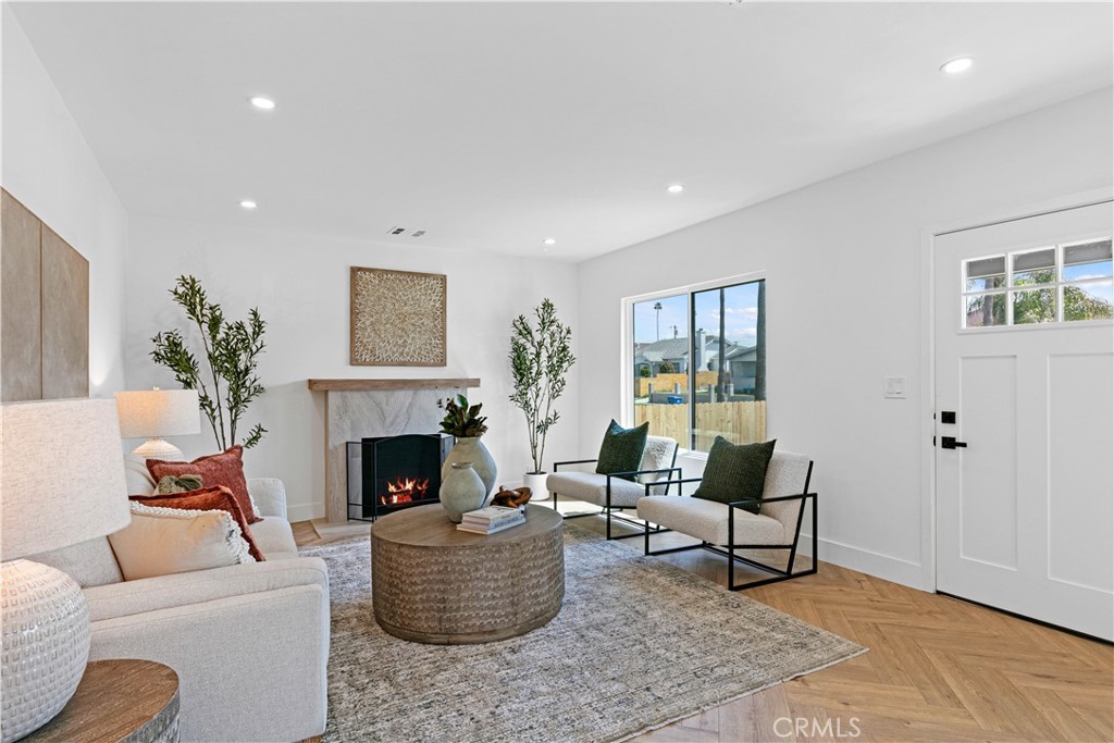 3937 2nd Avenue Los Angeles, CA 90008 - Photo 8 of 47 a living room with furniture and a fireplace