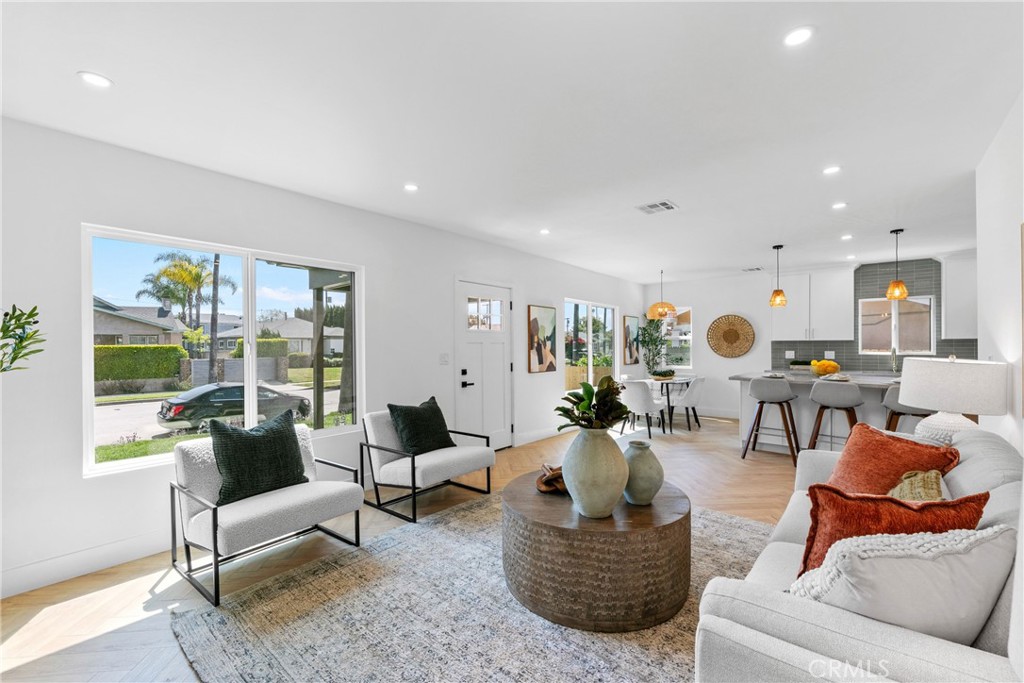 3937 2nd Avenue Los Angeles, CA 90008 - Photo 9 of 47 a living room with furniture a window and a table