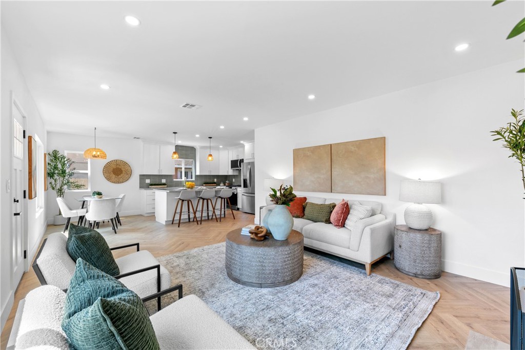 3937 2nd Avenue Los Angeles, CA 90008 - Photo 10 of 47 a living room with furniture and a table