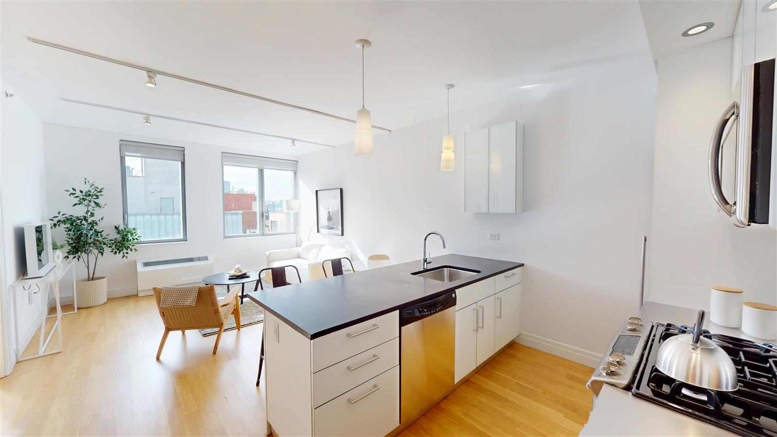 a kitchen that has a sink and a table in it