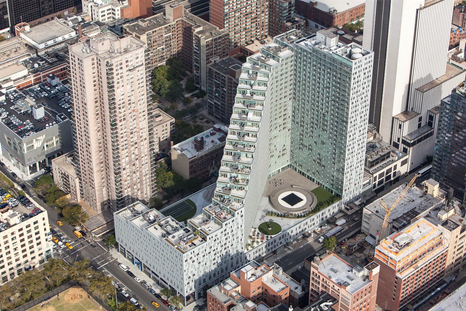 550 West 54th Street, Unit 952 Manhattan, NY 10019 - Photo 7 of 27 an aerial view of a house with a yard