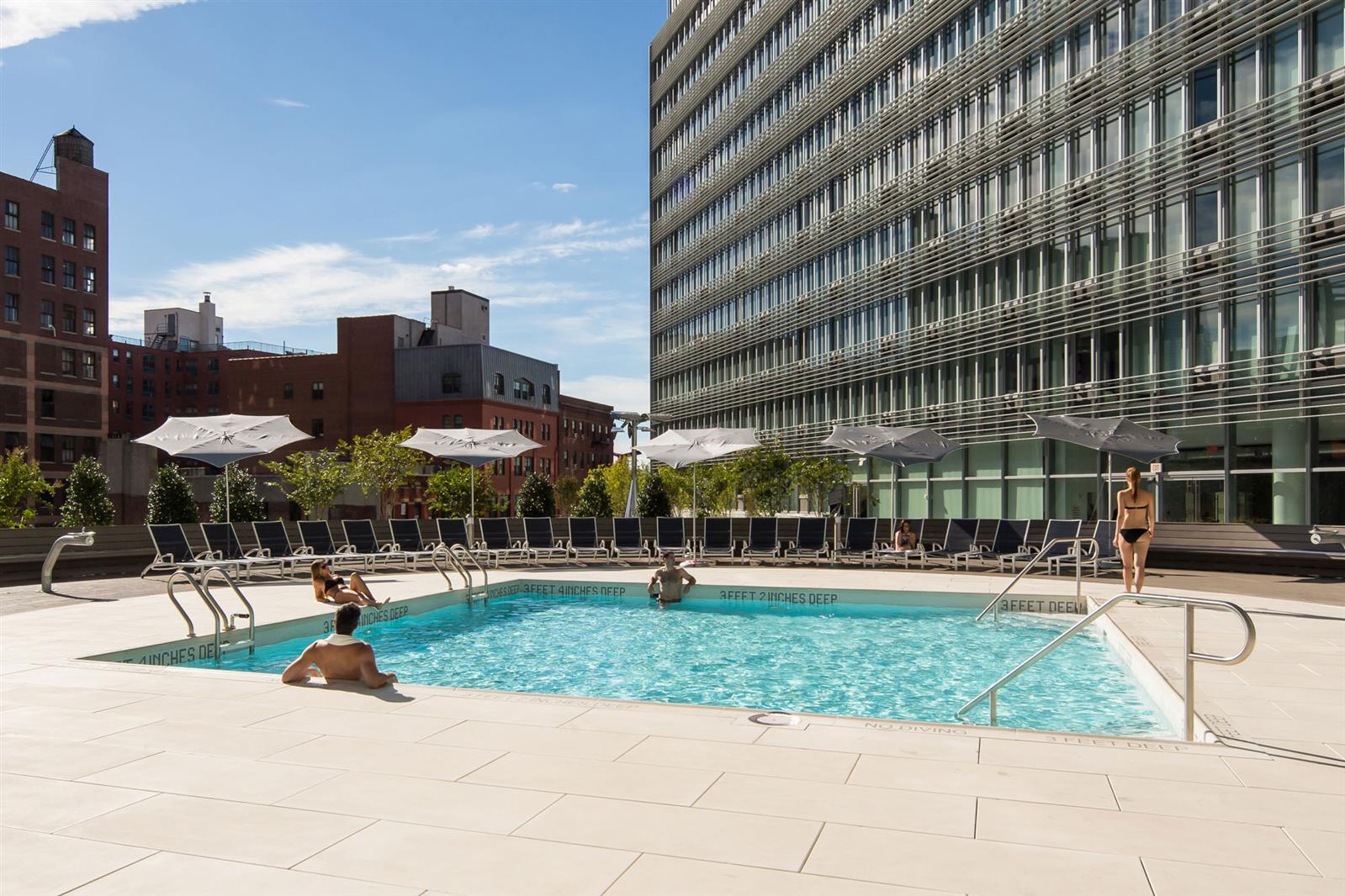 550 West 54th Street, Unit 952 Manhattan, NY 10019 - Photo 10 of 27 a view of a building with a yard