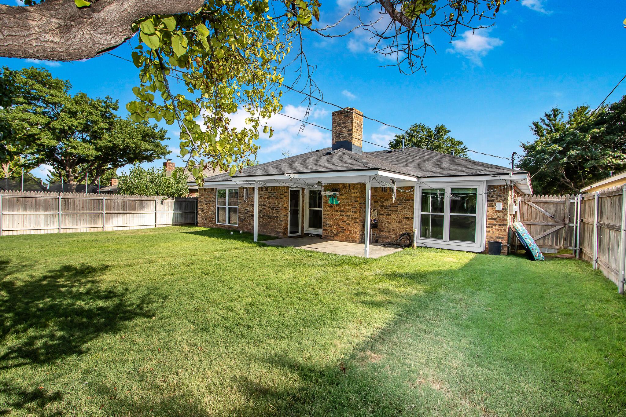 2208 Gresham Drive Amarillo, TX 79110 - Photo 29 of 31 a front view of a house with a garden