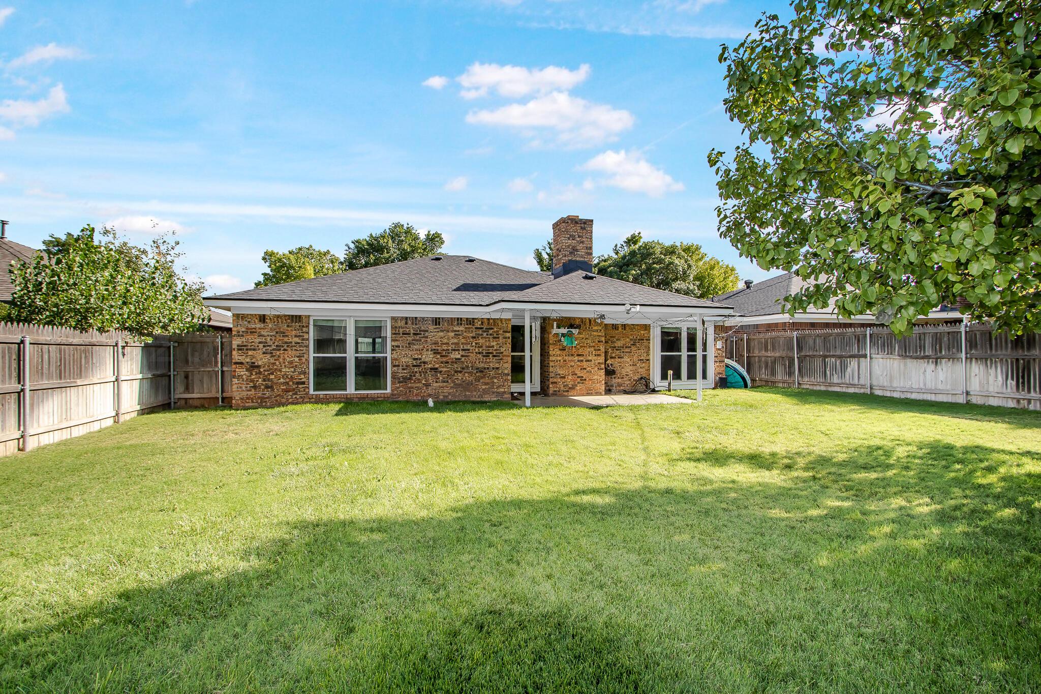2208 Gresham Drive Amarillo, TX 79110 - Photo 30 of 31 a front view of a house with a garden