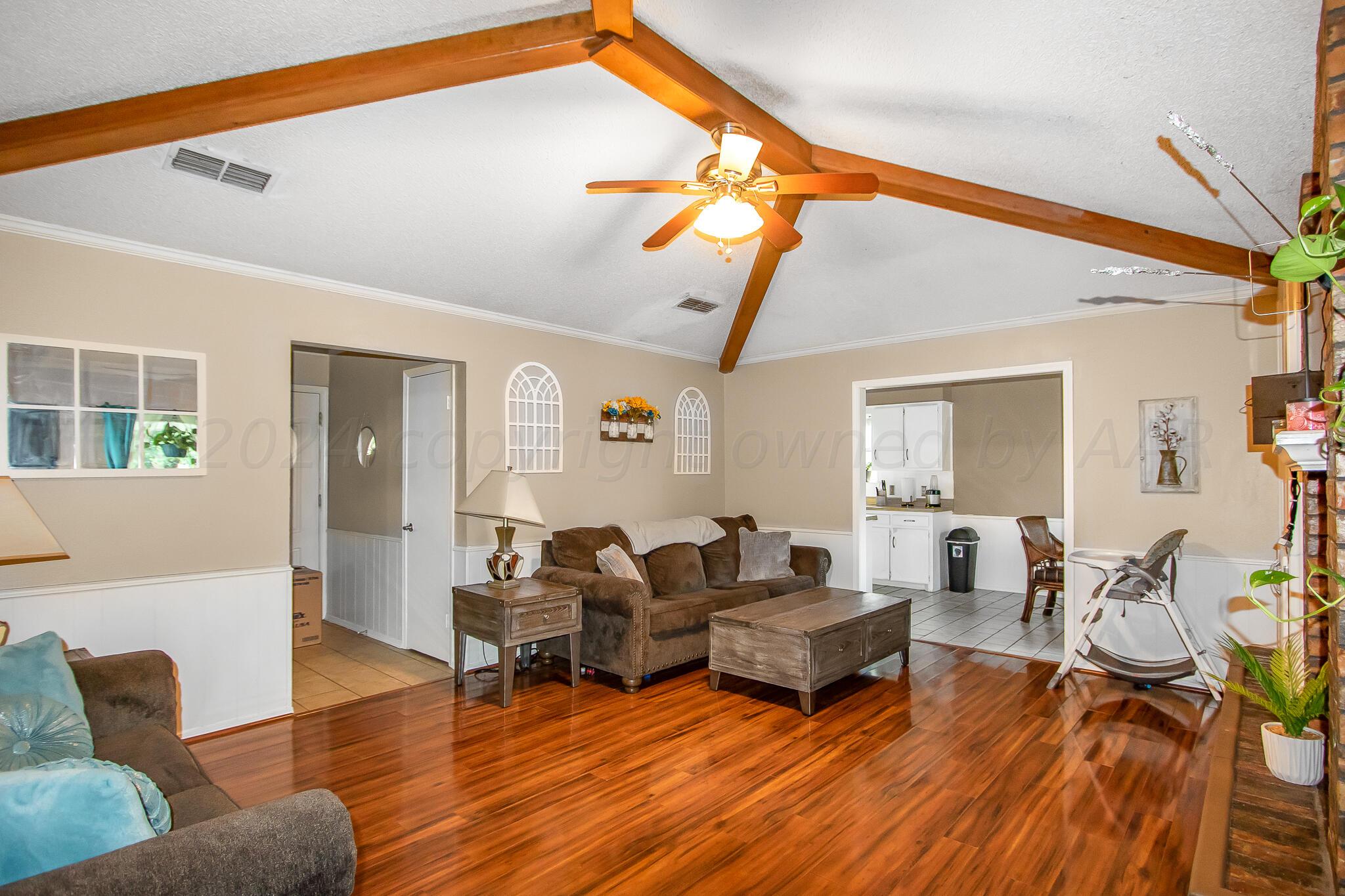 2208 Gresham Drive Amarillo, TX 79110 - Photo 8 of 31 a living room with furniture and wooden floor