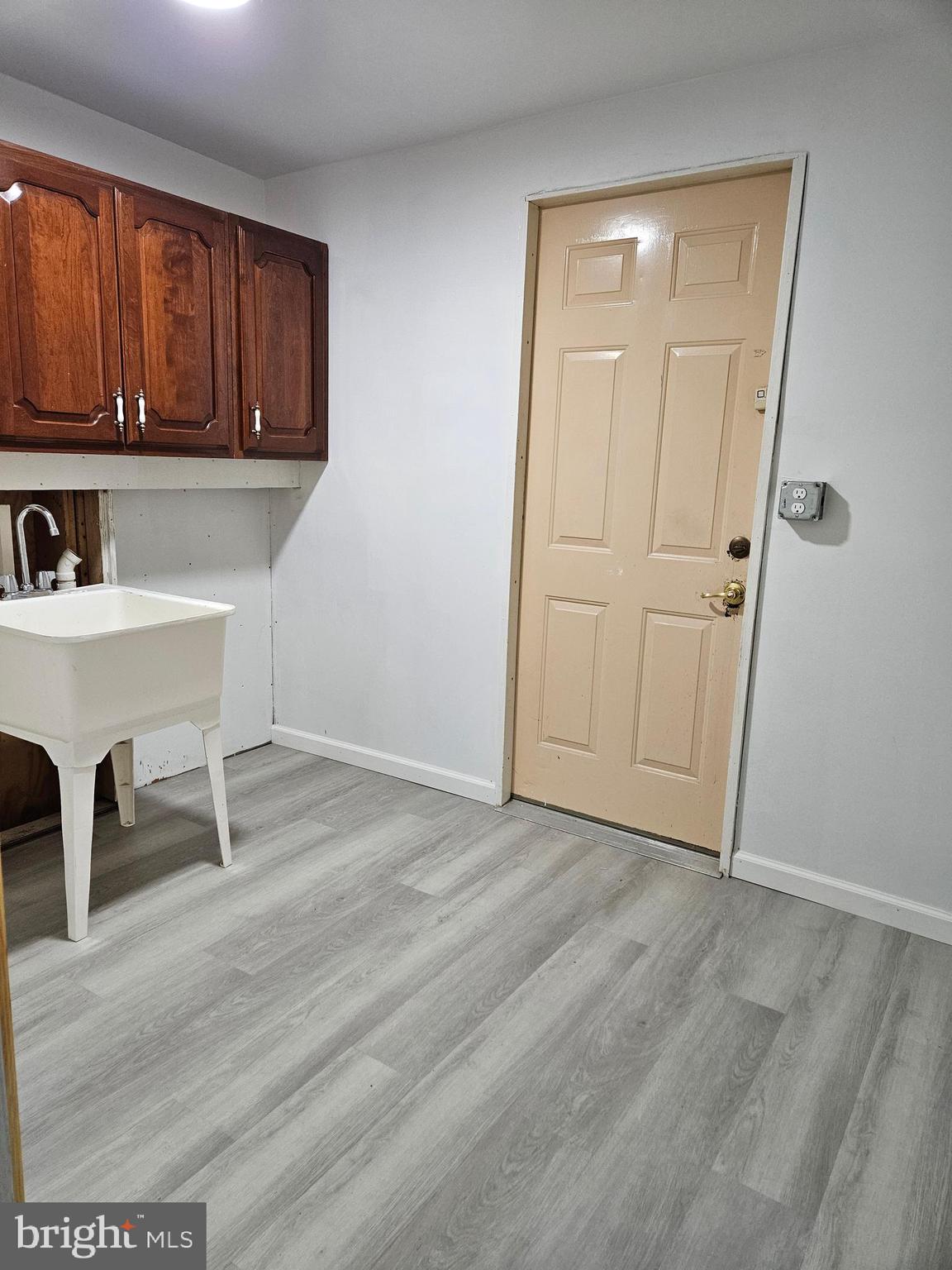 850 Byberry Road Philadelphia, PA 19116 - Photo 16 of 23 a view of a kitchen with wooden floor and cabinets