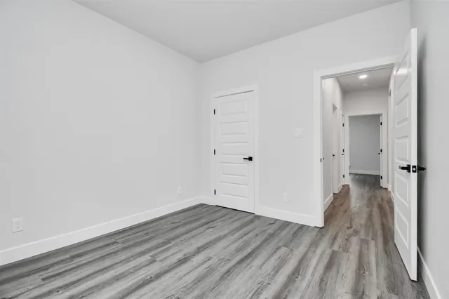 wooden floor and white walls