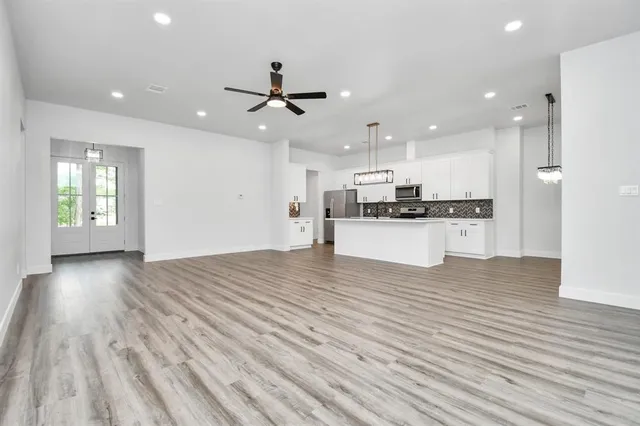 a view of kitchen with cabinets and wooden floor