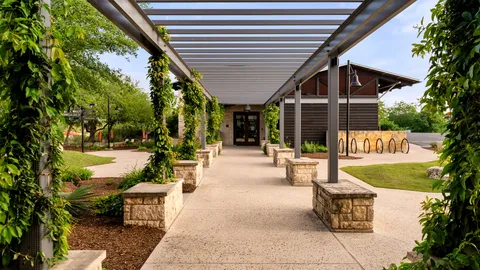 a view of house with swimming pool and sitting area