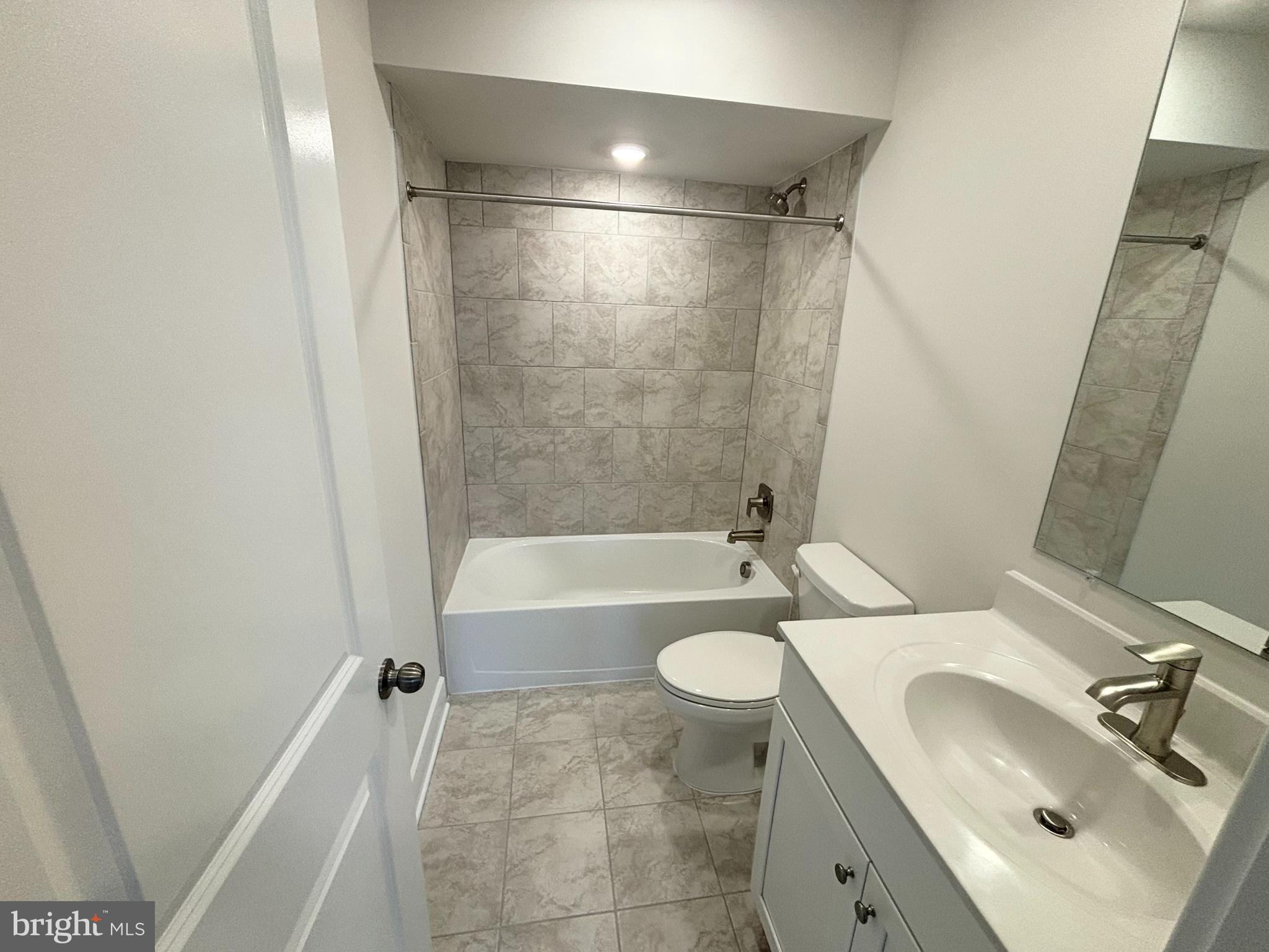 7260 Contee Road Laurel, MD 20707 - Photo 13 of 13 a bathroom with a sink toilet and shower